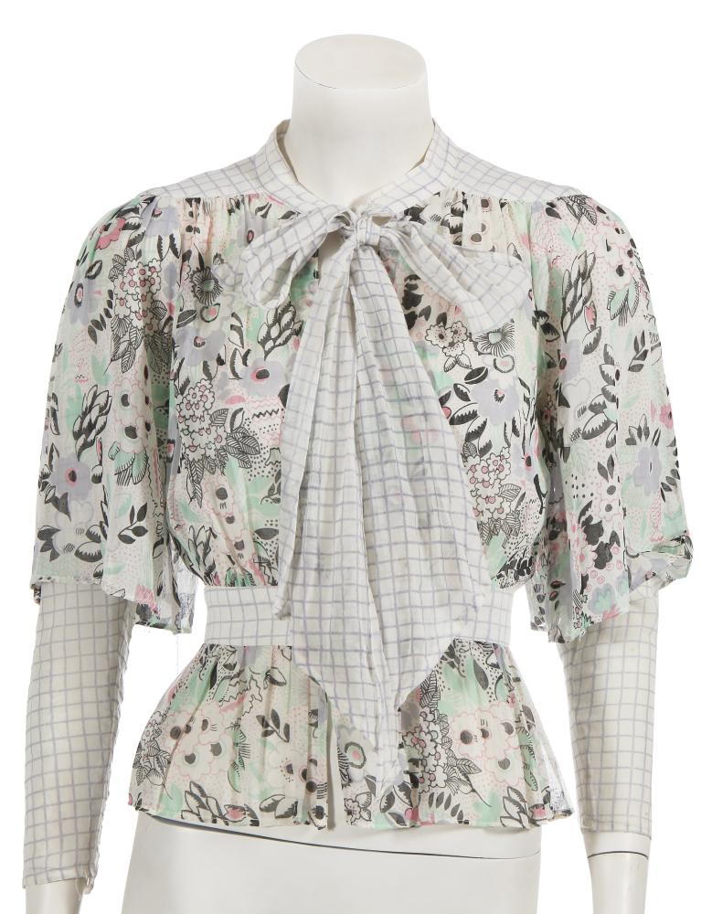 An Ossie Clark/Celia Birtwell for Radley ’Pretty Woman’ printed muslin blouse, 1970s

An Ossie Clark/Celia Birtwell for Radley ’Pretty Woman’ printed muslin blouse, 1970s

labelled, size 10, printed with spots, windowpane checks and floral designs in shades of blue, green, pink and black, with double sleeves, plunging neckline, self-covered buttons, self-ties to neck, bust 91cm 36in

Share this lot: