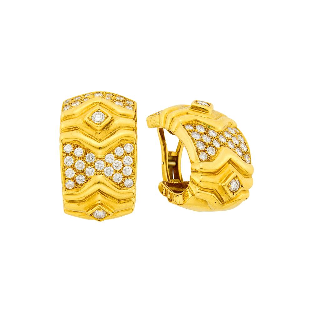 Property of a Distinguished Lady from Athens, Greece18 kt., 4 round diamonds ap. .50 ct., 64 round diamonds ap. 2.60 cts., attributed to Vourakis, no. r.73, ap. 28 dwts.

Diamonds: G-H-I-VS.Clip-backs. 1 1/4 x 3/4 inches.                            
Any condition statement is given as a courtesy to a client, is an opinion and should not be treated as a statement of fact and our Organization shall have no responsibility for any error or omission. Please contact the specialist department to request further information or additional images that may be available.