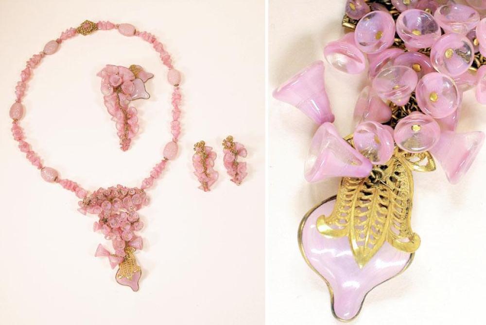 Miriam Haskell Parure

Lot 904
Miriam Haskell Parure
 American, 1950s 
 Of pink pate de verre, comprising a graduating pendant of clustered bell forms, a pin and earrings in same, with stylized leaves of filigree gilt-metal, signed: Miriam Haskell. 
Excellent condition.
 Estate of Joan Crawford Costume Jewelry, January 19, 1978, Plaza Art Galleries, New York, lot 435.
