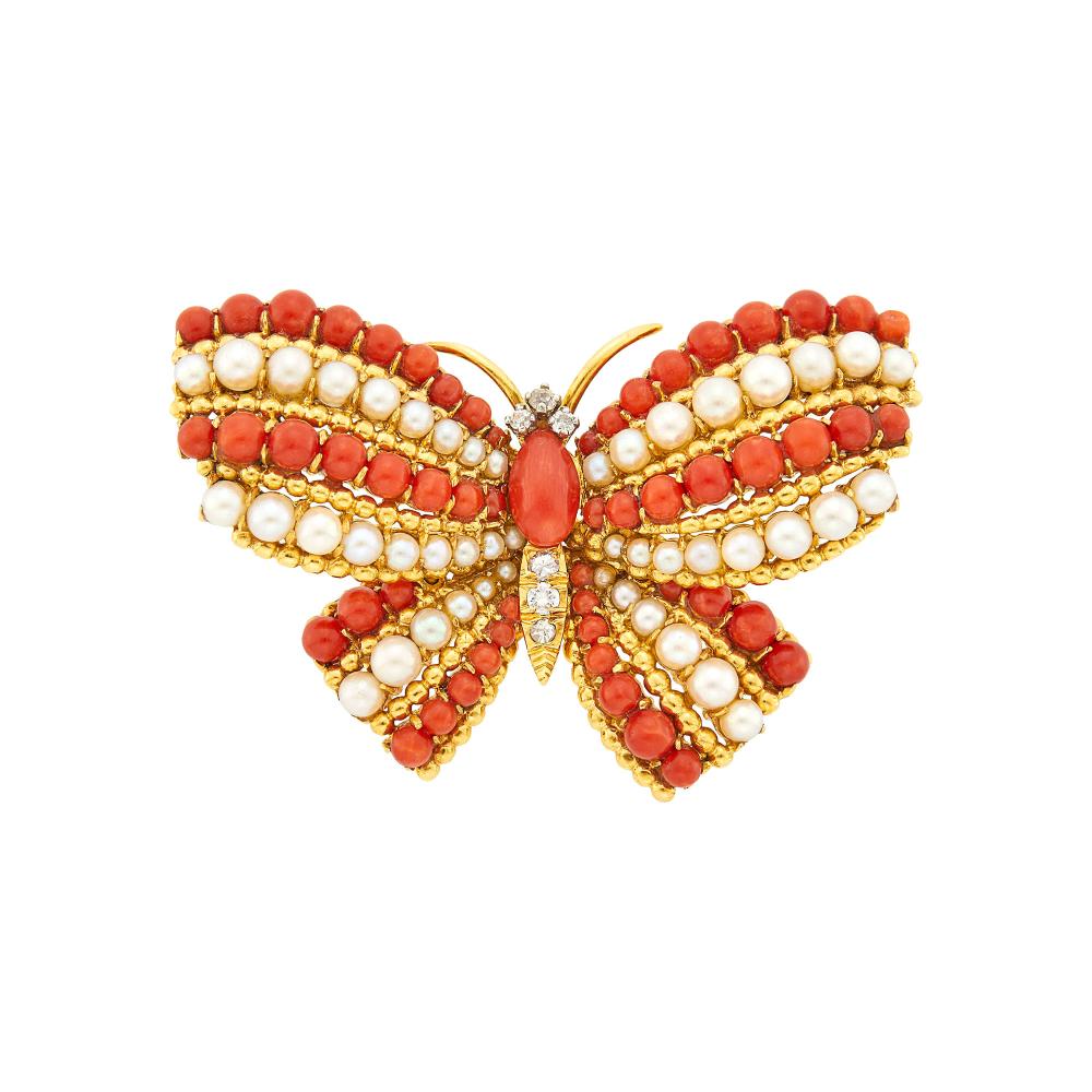 From the Estate of a Life-Long Upper East Side Woman18 kt., one modified navette-shaped coral, 6 small round diamonds, signed V.C.A., N.Y., Made in France, no. 1V802, with French assay mark and French export mark, ap. 16.6 dwts.

Coral: medium to medium deep orange to slightly reddish orange, good luste.Pearls: slightly creamy with rose and green orient, some minor bubbles or texture to nacre, good luster.2 1/8 x 1 1/4 inches.                            
Any condition statement is given as a courtesy to a client, is an opinion and should not be treated as a statement of fact and our Organization shall have no responsibility for any error or omission. Please contact the specialist department to request further information or additional images that may be available.