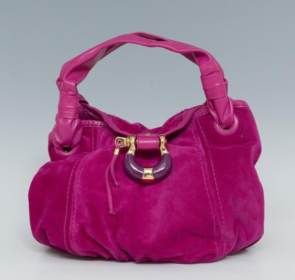 Description

JIMMY CHOO
Hazel Simone bag.
In fuchsia pink suede and tone-on-tone leather details. Features gold-tone metal hardware. Magnet closure and fabric lined interior.
Includes dust bag.
Exhibits wear consistent with age and use.
Measurements: 27 x 35 x 15,5 cm.

Jimmy Choo is one of the most recognized brands of contemporary luxury, especially in the world of women’s footwear. Founded in 1996 by designer Jimmy Choo and fashion editor Tamara Mellon, the brand was born in London with a clear proposal: to combine traditional craftsmanship with modern glamour.

Includes dust bag. Exhibits wear consistent with age and use.