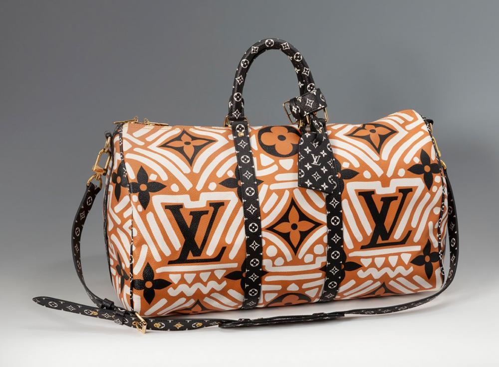 Description

LOUIS VUITTON.
Crafty Keepall travel bag. Limited edition.
Caramel, cream and black leather embossed with LV logo. Metal hardware. Short handles, adjustable shoulder strap and black and white monogrammed straps. Interior in monogrammed fabric.
In good condition.
Measurements: 46 x 27 x 22 cm.
In the LV Crafty collection, Louis Vuitton transforms the Monogram Giant canvas with vivid graphics and ultra-graphic prints. It is inspired by two artistic movements of the second half of the 20th century: graffiti art and neo-expressionism. The collection was available in two colors, cream with caramel and bright red.

In good condition.