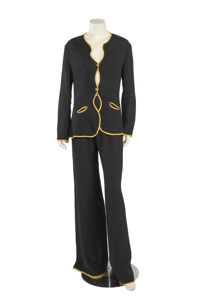 An Ossie Clark black moss crêpe ’Judy’ trouser suit, circa 1969

An Ossie Clark black moss crêpe ’Judy’ trouser suit, circa 1969

labelled, size 38, the top with undulating borders piped in yellow satin, bust 97cm 38in; the flared trousers similarly trimmed, with slits to the rear hems, waist 66cm 26in (2)

Share this lot: