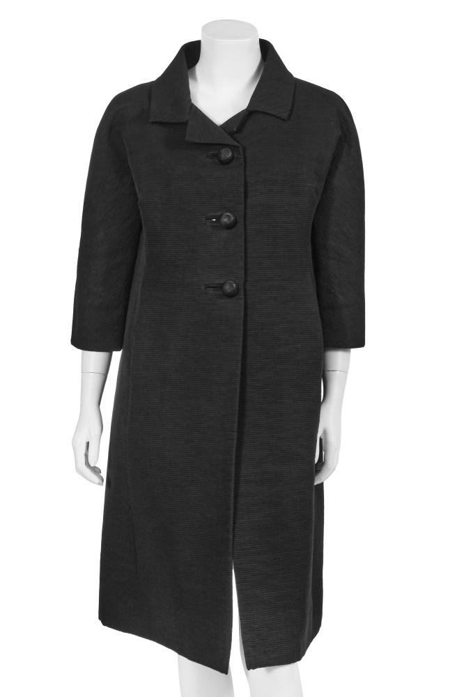 A Cristóbal Balenciaga haute couture black silk Ottoman coat, circa 1960

A Cristóbal Balenciaga haute couture black silk Ottoman coat, circa 1960

labelled and numbered 71917, of boxy cut and clever construction with elbow-length sleeves, curved seams to front, concealed pockets, three carved jet buttons, bust 107cm 42in

Share this lot: