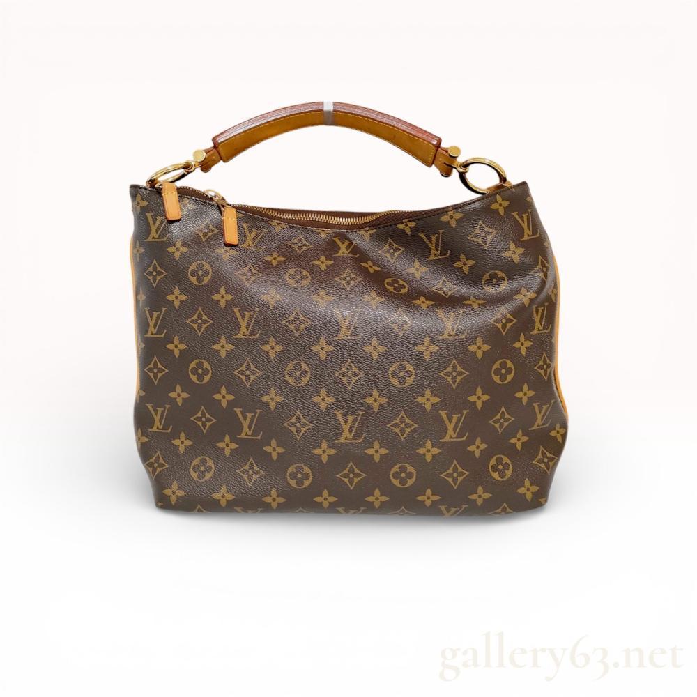 Description
Louis Vuitton Sully MM shoulder bag in signature Monogram coated canvas with natural Vachetta leather trim, circa 2012. The hobo-style silhouette features a thick, curved leather handle with heat-stamped branding, gold-tone brass rings, and a top zippered closure. The interior is lined in brown textile with two slip pockets and a leather tab incised with date code TJ2182.
Width: 14 inches
Height: 12 inches
Depth: 5.5 inches.