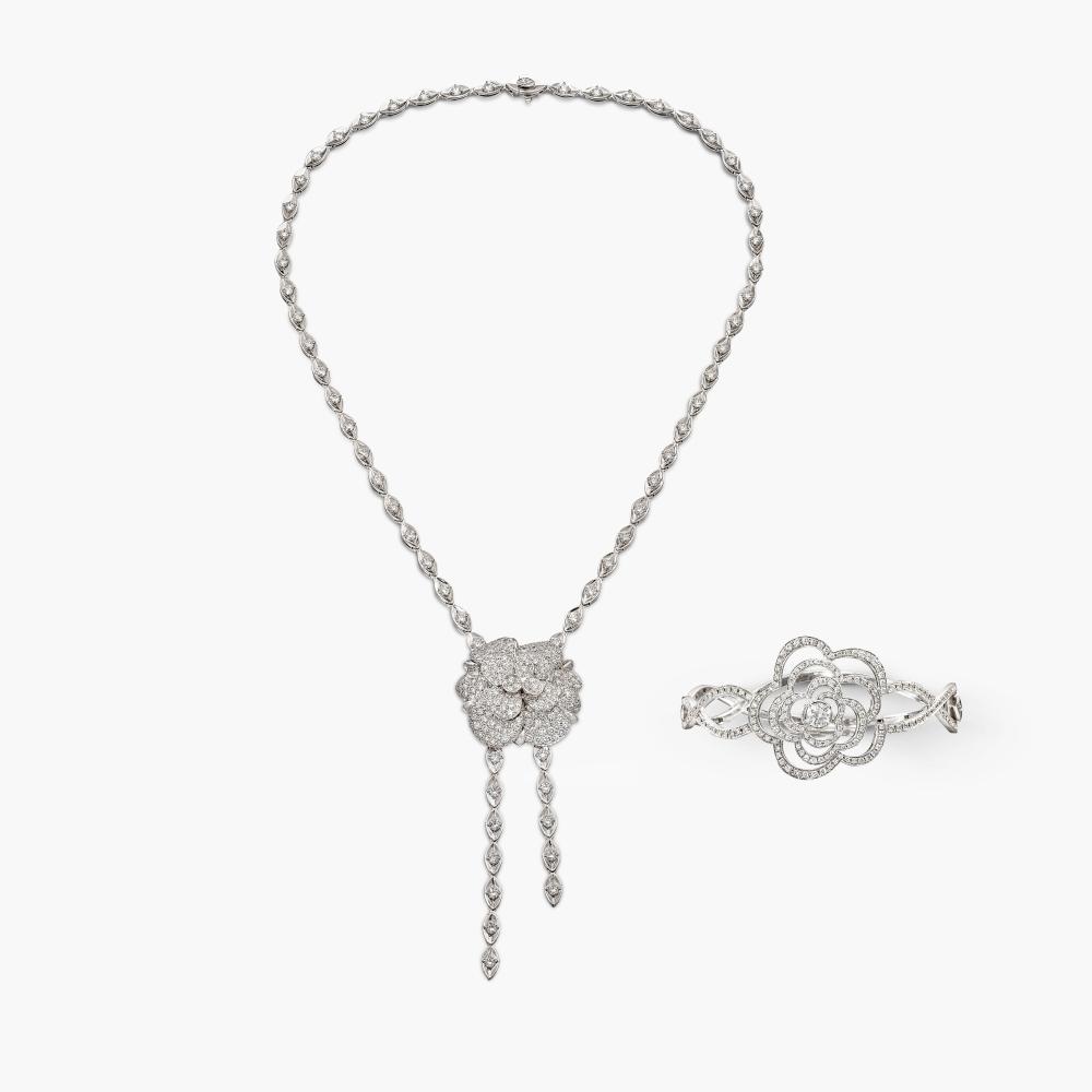 Chanel

The sautoir necklace designed as camellia suspended from a marquise-shaped linkchain decorated with brilliant-cut diamonds; and bangle of stylised camellia design, decorated with brilliant-cut diamonds.