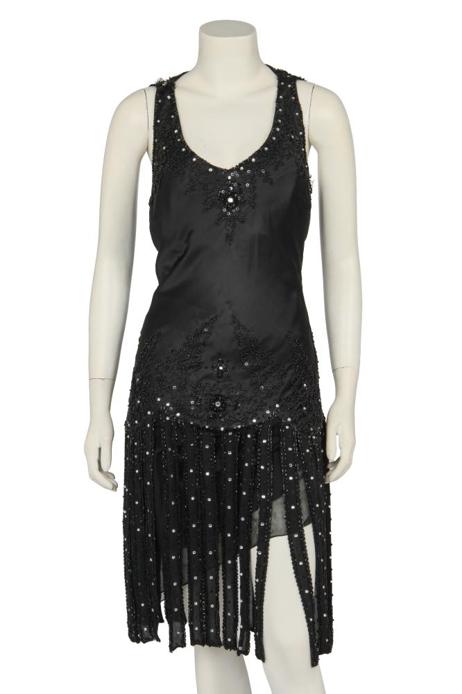 A Donatella Versace embellished black satin dress, 2010s

A Donatella Versace embellished black satin dress, 2010s

Jeans Couture label, size 42, with rhinestone, sequin and black bead trimmings, similarly decorated black chiffon fringed hem, black chiffon under-skirt, bust 86cm 34in

Share this lot: