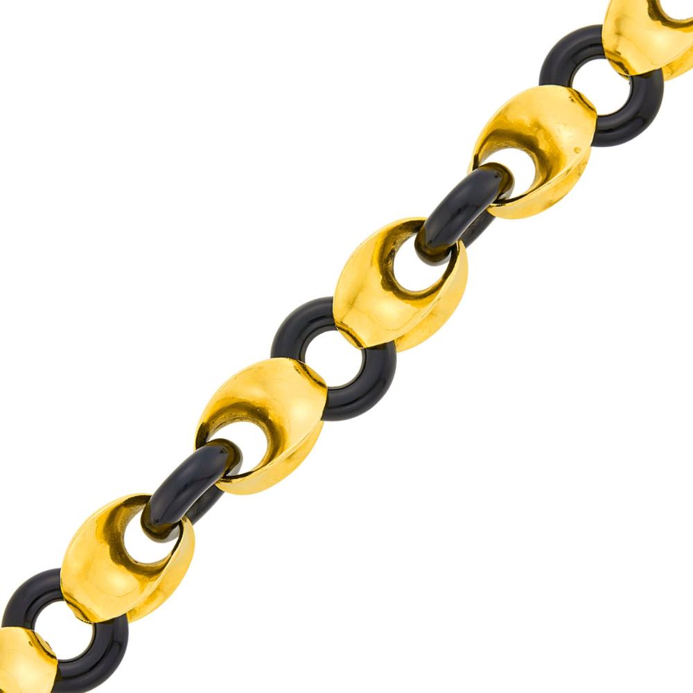 Estate of a Florida Lady18 kt., fancy-shaped gold and black onyx circle links, signed VCA, no. 2V755.2, with maker’s mark and French assay mark, ap. 48.3 dwts. gross. Length 6 1/4 inches.

Gold link width 1/2 inch. Circle link diameter 5/8 inch.                            
Any condition statement is given as a courtesy to a client, is an opinion and should not be treated as a statement of fact and our Organization shall have no responsibility for any error or omission. Please contact the specialist department to request further information or additional images that may be available.