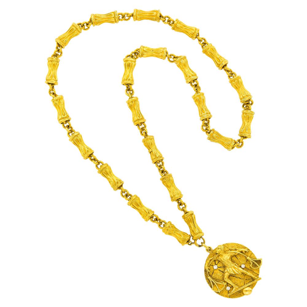 Property of a Distinguished Lady from Athens, Greece18 kt., 3 round diamonds ap. .30 ct., both signed Tiffany & Co., Italy, ap. 153.7 dwts. Length 30 1/2 inches.
 
Please note that the pendant and the link necklace are signed Tiffany & Co.Notes:Chain tests as 18 kt. Jump ring stamped for 14 kt.
Diamonds: F-G-VS
Pendant diameter 1 3/4 inches.
Bamboo link width 5/16 inch.