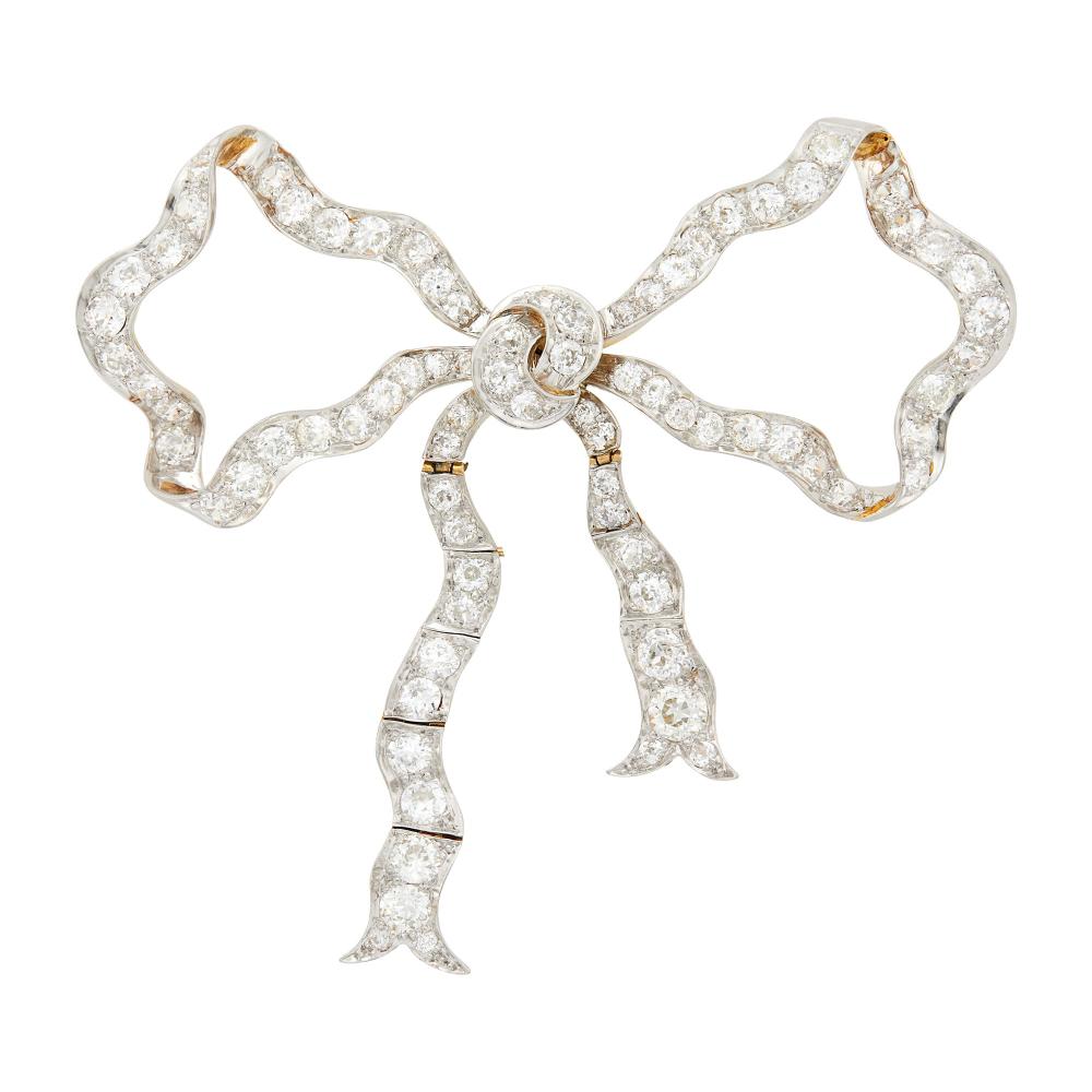 Property from a Prominent Maryland Collection80 old European and old-mine cut diamonds ap. 10.70 cts., signed Gattle, circa 1905, ap. 21 dwts.
 
Please note that one ribbon is broken and will be repaired by Doyle.

Tests as 18 kt.Diamonds: H-I-J-VS-SI.Nicely articulated ribbon fringe.3 3/8 x 3 inches.                            
Any condition statement is given as a courtesy to a client, is an opinion and should not be treated as a statement of fact and our Organization shall have no responsibility for any error or omission. Please contact the specialist department to request further information or additional images that may be available.