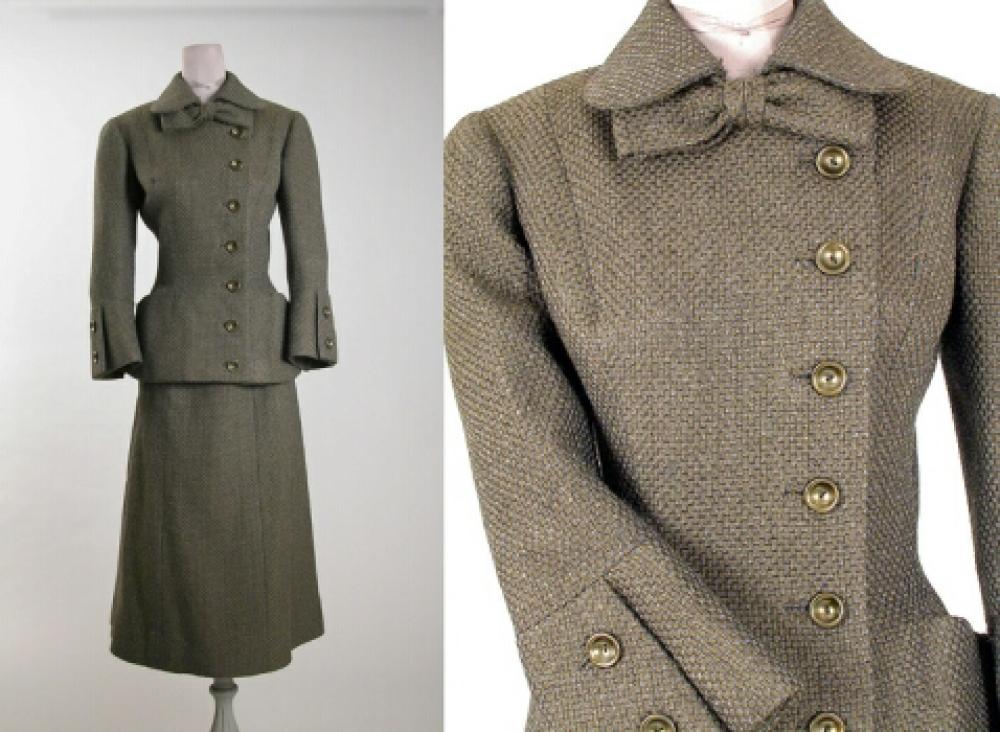 Jacques Fath Day Suit

Lot 527
Jacques Fath Day Suit
 French 1950s 
 Suit of olive green and gray tweed, three-quarter length sleeves, with two button bell cuffs, Peter Pan collar and bell closure and mid-calf skirt, size 2, labeled: Jacques Fath/Paris. 

 Estate of Isabel Brewster Van Dine