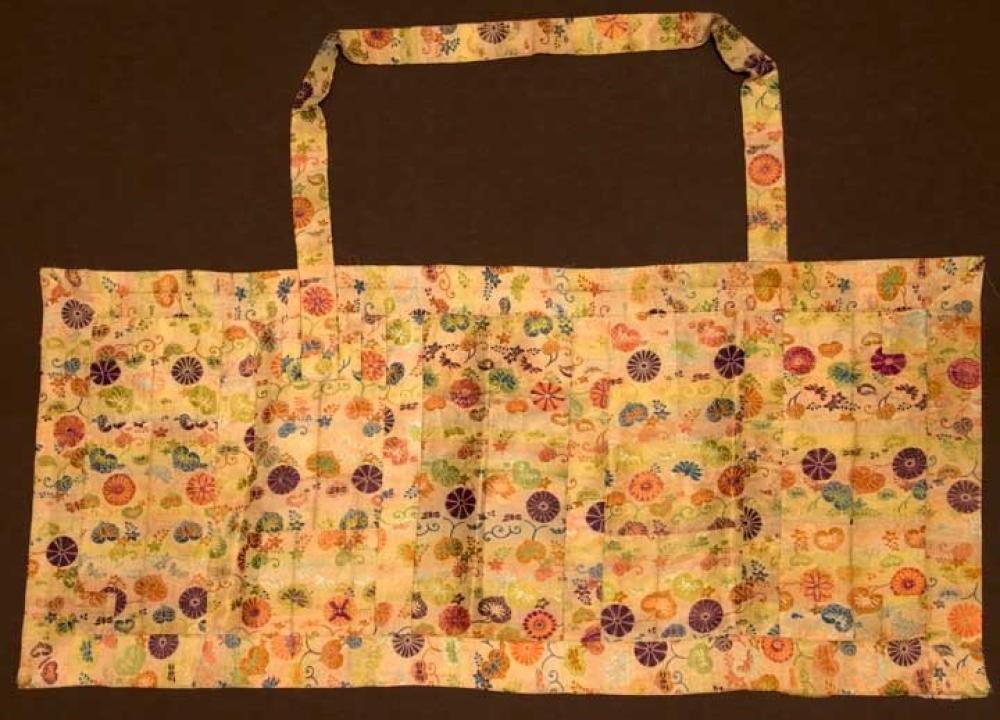 MONK’S KESA, JAPAN, EDO PERIOD

Monk’s outer robe, patchwork of silk brocade lotus blossoms & leaves in orange, green, blue & plum on striped cream & faint pastel ground, hand sewn & later in 20th C some seams re-sewn by machine, 22