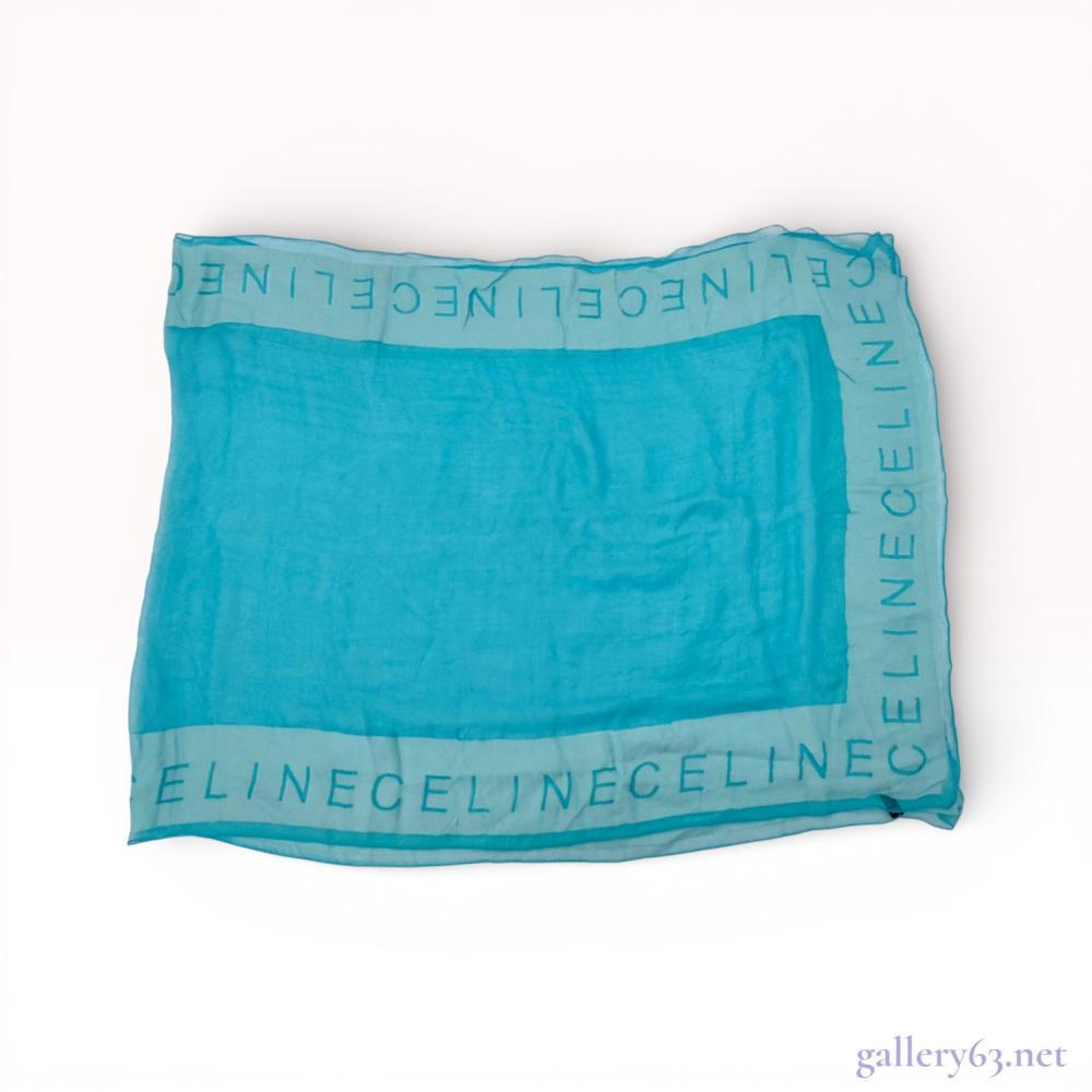 Description

This Celine designer wrap scarf is crafted in Italy from a delicate blend of 85 percent silk and 15 percent rayon-viscose. The vibrant turquoise-blue accessory features a gauzy mesh weave with a solid rectangular center. It is framed by a lighter blue border with repeating CELINE block lettering created through a textural change in the weave density. Approximately 36 by 36 inches. 




The Celine silk-blend gauze scarf with logo border is a piece from the house’s most accessible silk format - the lightweight gauze construction is designed for warm-weather wearing and draping rather than the structured folding of heavier twill. Logo border Celine scarves in gauze are particularly photogenic and represent the house’s name at its most casually wearable.