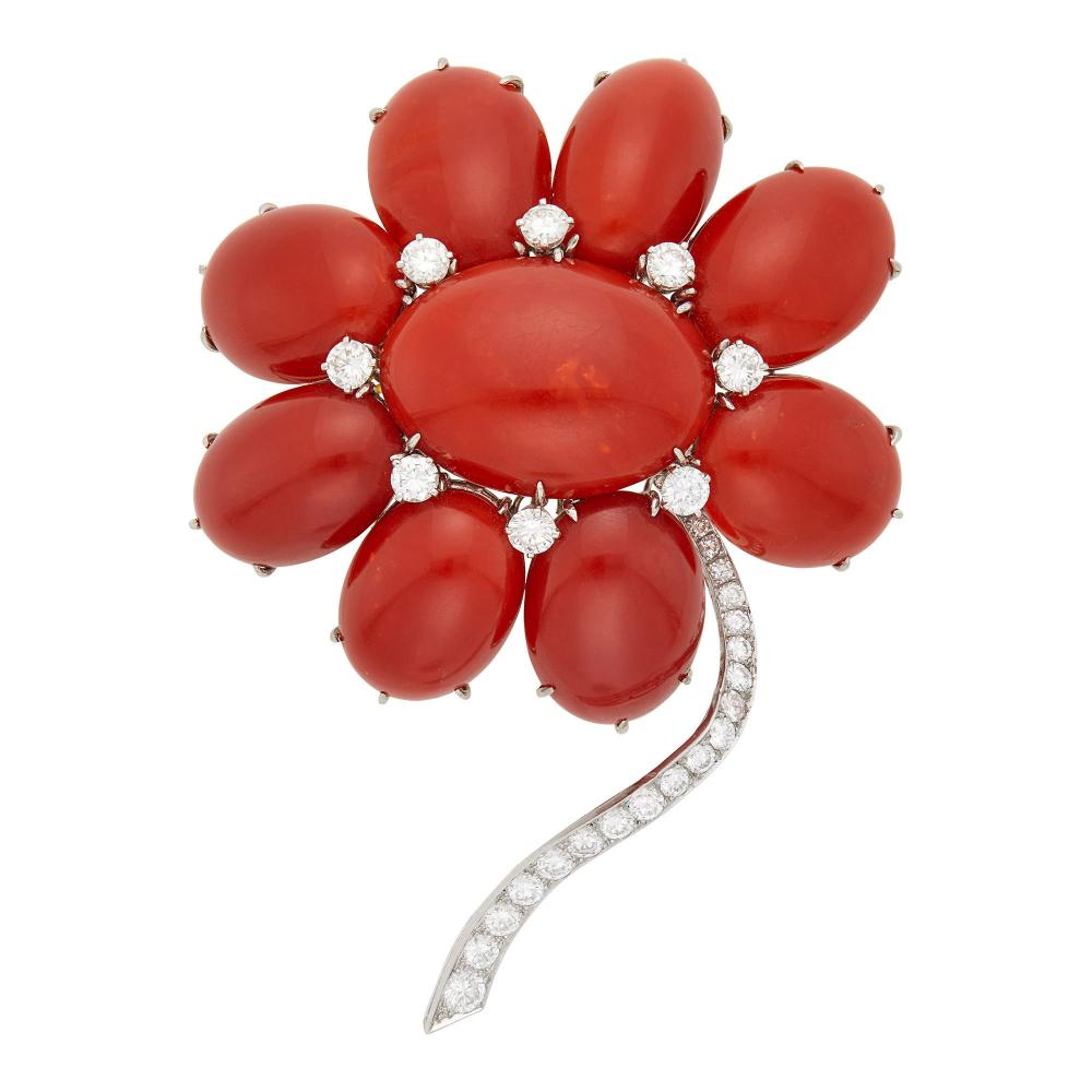 Property from a Prominent Maryland CollectionOne oval cabochon oxblood coral ap. 28.0 x 21.0 x 8.6 mm., 8 oval cabochon oxblood coral ap. 22.0 x 16.0 x 6.0 to 23.0 x 14.0 x 9.0 mm., 8 round diamonds ap. 2.80 cts., 21 round diamonds ap. 2.00 cts., signed Staal, ap. 45.4 dwts. gross.

Coral: deep red to slightly orangy red, small mottling patch off-center of center stone, small pore, overall even color, light scratches, good luster.Diamonds: G-H-I-VS.3 1/2 x 2 5/8 inches.                            
Any condition statement is given as a courtesy to a client, is an opinion and should not be treated as a statement of fact and our Organization shall have no responsibility for any error or omission. Please contact the specialist department to request further information or additional images that may be available.