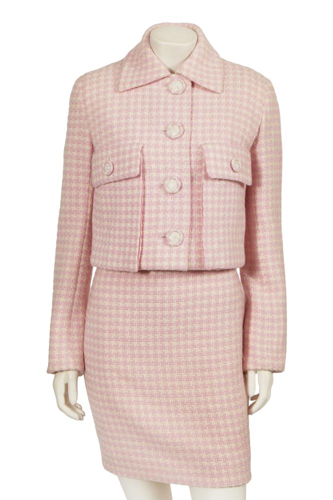 A Gianni Versace haute couture pink tweed suit, circa 1994

A Gianni Versace haute couture pink tweed suit, circa 1994

Atelier labelled, comprising: a sleeveless, high-necked sheath dress, bust 91cm 36in; and a matching cropped jacket with two deep patch pockets, white snakeskin-effect and pink tweed buttons, bust 91cm 36in (2)

Share this lot: