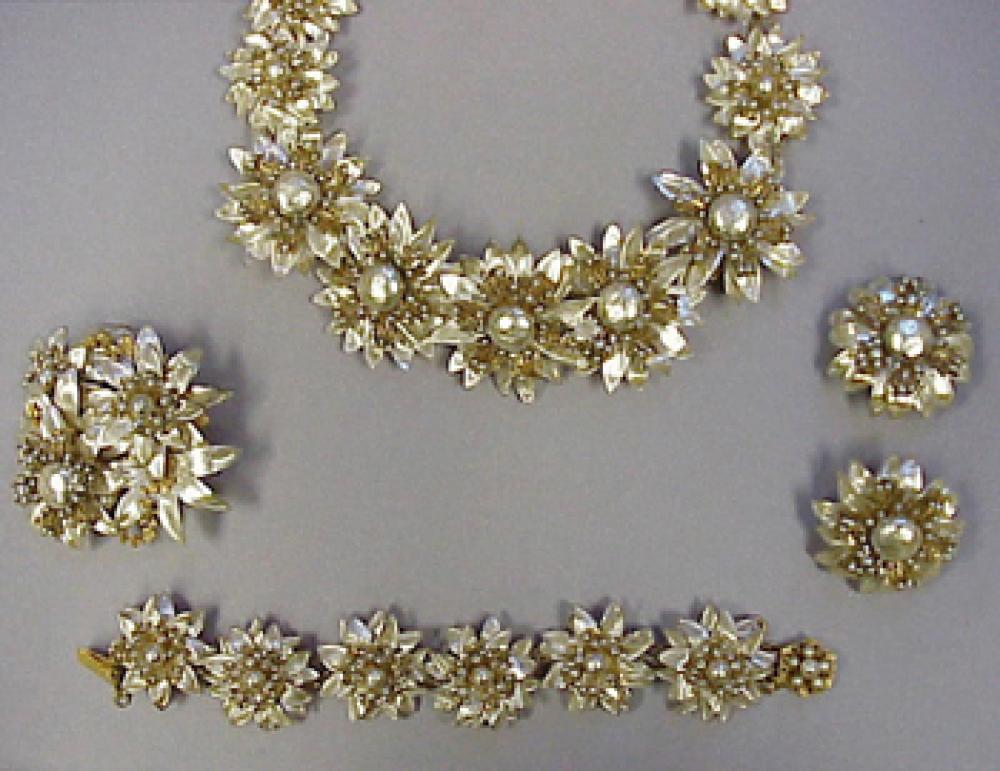 Miriam Haskell Suite

Lot 251
Miriam Haskell Suite
 Comprising a necklace, pin, two bracelets and earrings, faux pearlized flowers with seed pearls and gilt filigree. 
 The suite is from the Estate of Joan Crawford