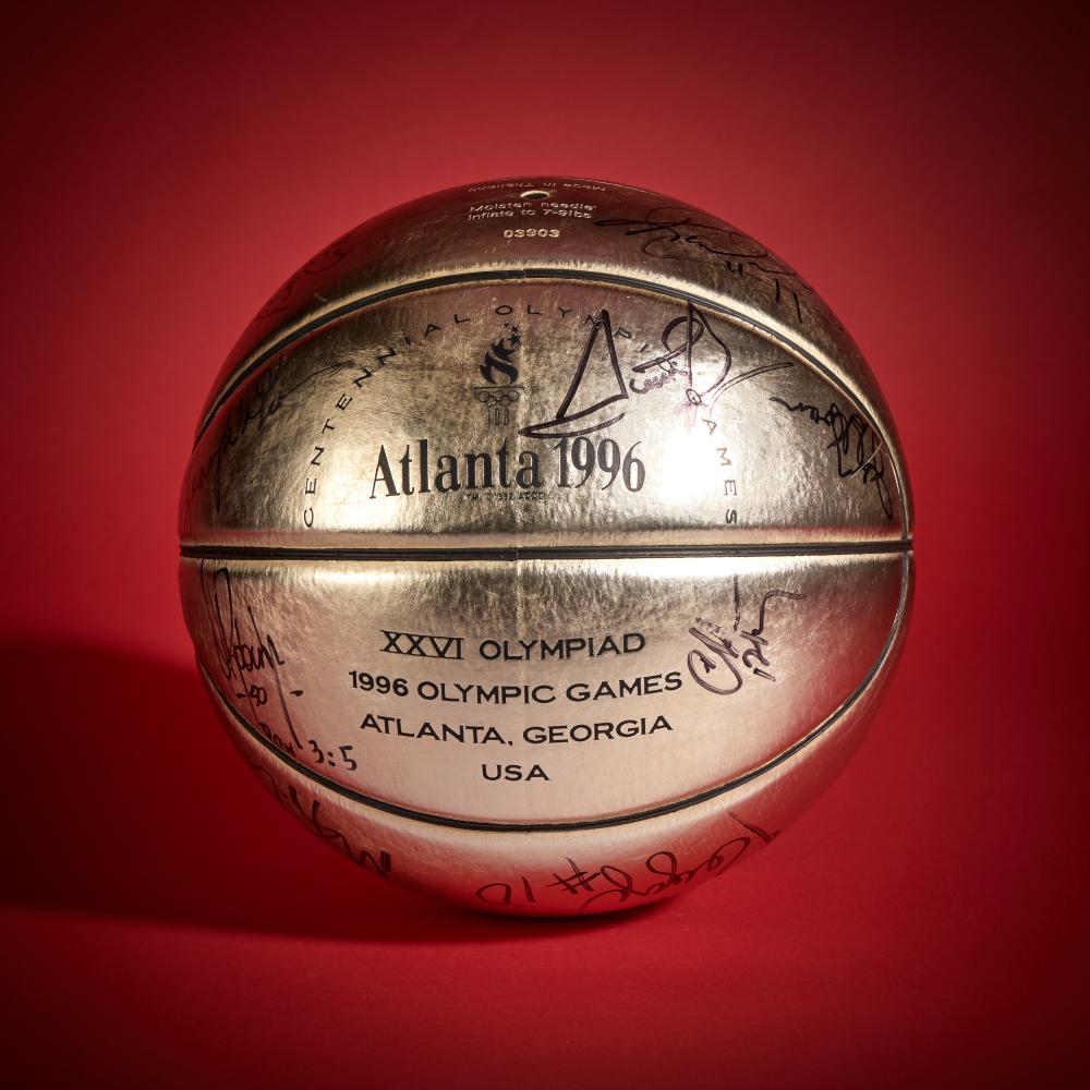 1996 Team USA Signed Basketball | Signed by Shaquille O’Neal, Reggie Miller, Scottie Pippen, Charles Barkley, Penny Hardaway, and Others

MOLTEN

Circa 1996

Offered in this lot is a basketball signed by players and coaches of the 1996 United States Men’s Olympic Basketball Team, the group that represented the U.S. at the Atlanta Summer Games. Often referred to as “Dream Team III,” the roster reflected the next phase of USA Basketball, combining experienced Olympians with established NBA stars.

The team was led by veterans such as Scottie Pippen and Charles Barkley, both returning from the 1992 Olympic squad. Pippen played a central role, contributing across defense, playmaking, and leadership, while Barkley provided continuity between the original Dream Team and the mid-1990s generation of NBA talent.

They were joined by a deep roster that included Grant Hill, Penny Hardaway, David Robinson, Mitch Richmond, Reggie Miller, Karl Malone, John Stockton, Shaquille O’Neal, Gary Payton, and Hakeem Olajuwon. Under the guidance of head coach Lenny Wilkens, the team blended experience and cohesion throughout the tournament.

The United States won all eight games in Atlanta to secure the gold medal. Signed by members of this Olympic roster, the basketball represents a key moment in the continued dominance of U.S. basketball on the international stage.

Signed by Scottie Pippen, Charles Barkley, Grant Hill, Penny Hardaway, David Robinson, Mitch Richmond, Reggie Miller, Karl Malone, John Stockton, Shaquille O’Neal, Gary Payton, and Hakeem Olajuwon, this basketball comes directly from the Collection of Scottie Pippen.

The basketball is also accompanied by a letter from James Spence Authentication in regards to the signatures.
