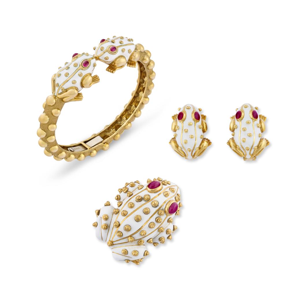 DAVID WEBB SUITE OF RUBY AND ENAMEL ‘FROG’ JEWELLERY

Comprising a bangle, a brooch and a pair of earrings 
Cabochon rubies, white enamel, 18k and 14k yellow gold, signed Webb 
Size/Dimensions: bangle with an inner circumference of 15.0 cm; brooch 4.2 cm high; earrings 2.4 cm high 
Gross weight: 129.9 grams