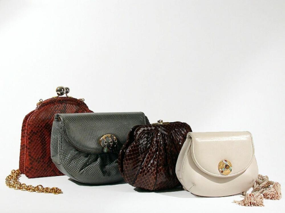 Four Judith Leiber Mini-Shoulder Bags

Lot 868
Four Judith Leiber Mini-Shoulder Bags
 The first of gray gathered karung, the flap with gilt-metal and drop semiprecious stone clasp, self strap with gray silk tassel, 7 x 5 1/2 inches; the second of mottled red snakeskin with gilt-metal chain, 6 1/2 x 6 inches; the third of chocolate brown lizard gathered into self frame with strap, 7 x 5 inches; the last of greige kid with American Indian style ornamental clasp, rope strap and tassel, 5 1/2 x 4 1/2 inches, all labeled: Judith Leiber.
All very good condition.