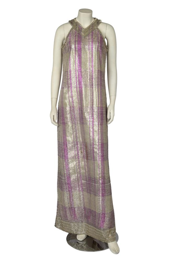 A Mila Schon beaded evening gown, late 1960s

A Mila Schon beaded evening gown, late 1960s

labelled, with silver-bugle beaded and rhinestone-edged neckband, underarms and hem, open shoulders, the white tulle ground applied with silver and pink irregular bugle beaded stripes and part lined in silver and pink lamé, bust 86cm 34in

Share this lot:
