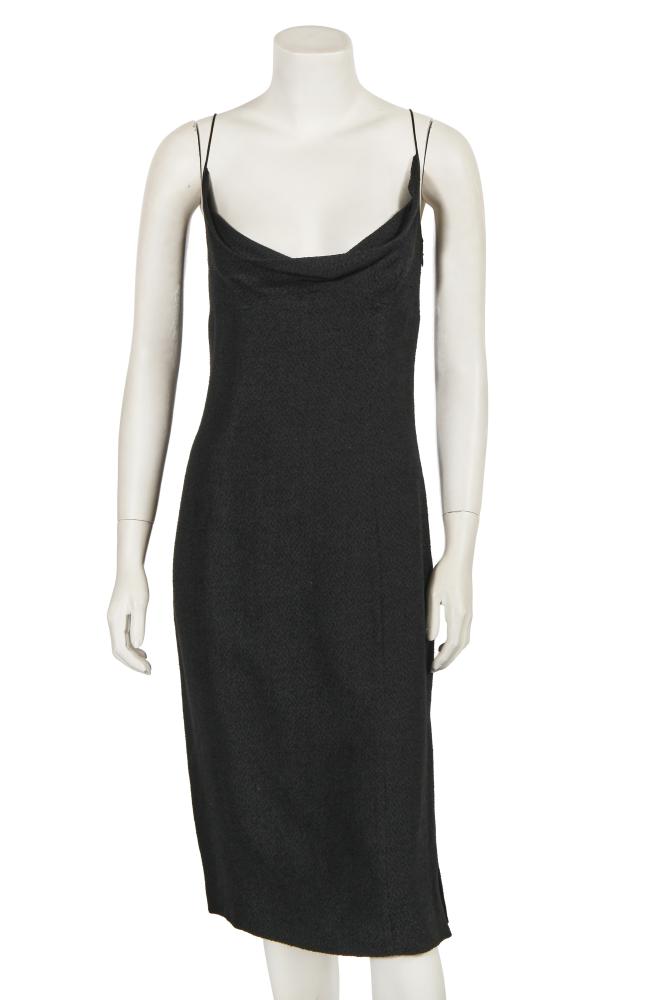 A John Galliano black bouclé silk midi dress, ’Ballets Russes’ collection, Spring-Summer 1999

A John Galliano black bouclé silk midi dress, ’Ballets Russes’ collection, Spring-Summer 1999

labelled, size 14, with cowl neckline, empire waistline, slender black satin straps, kick split to skirt, bust approx 97cm 38in

Share this lot: