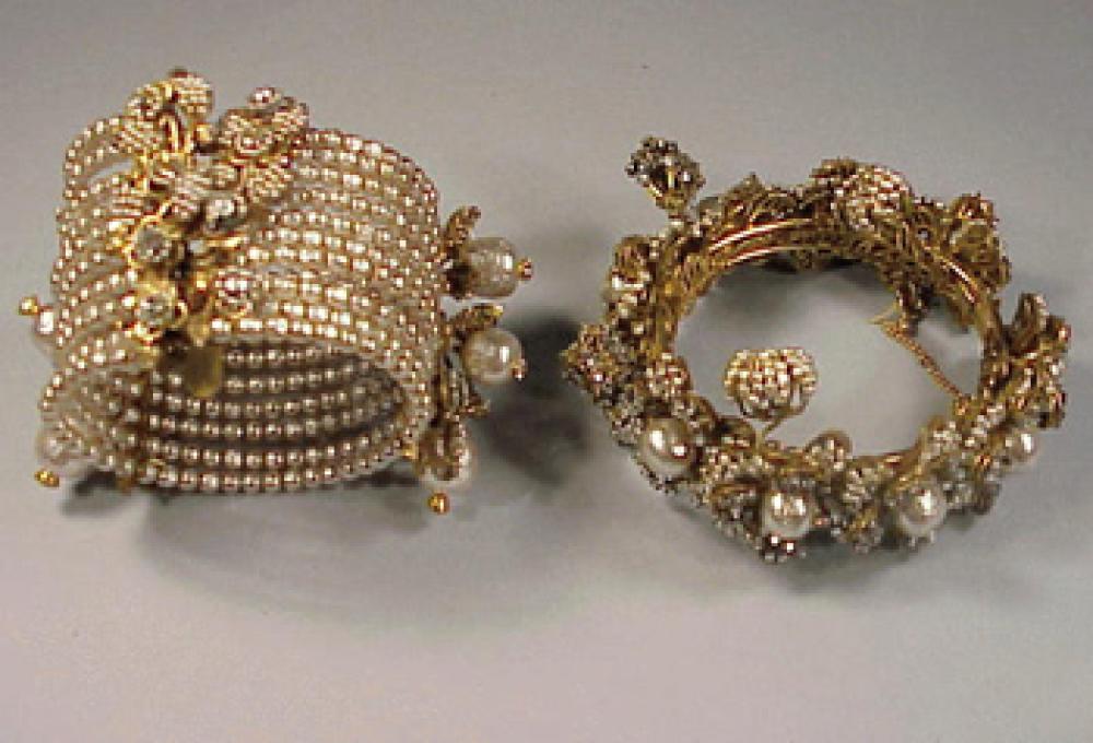 Two Miriam Haskell Bracelets

Lot 230
Two Miriam Haskell Bracelets
 One pearl spring cuff, one bangle with pearl cluster flowers, marked.