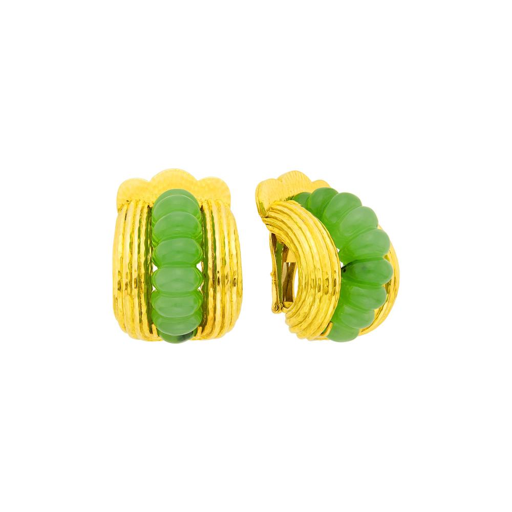 Property from a Prominent Maryland Collection18 kt., two bombé jade shrimp panels, signed Webb, ap. 28 dwts. gross.

Jade: medium light apple green with some black spots, translucent, good luster.Clip-backs. 1 1/8 x 7/8 inches.                            
Any condition statement is given as a courtesy to a client, is an opinion and should not be treated as a statement of fact and our Organization shall have no responsibility for any error or omission. Please contact the specialist department to request further information or additional images that may be available.
