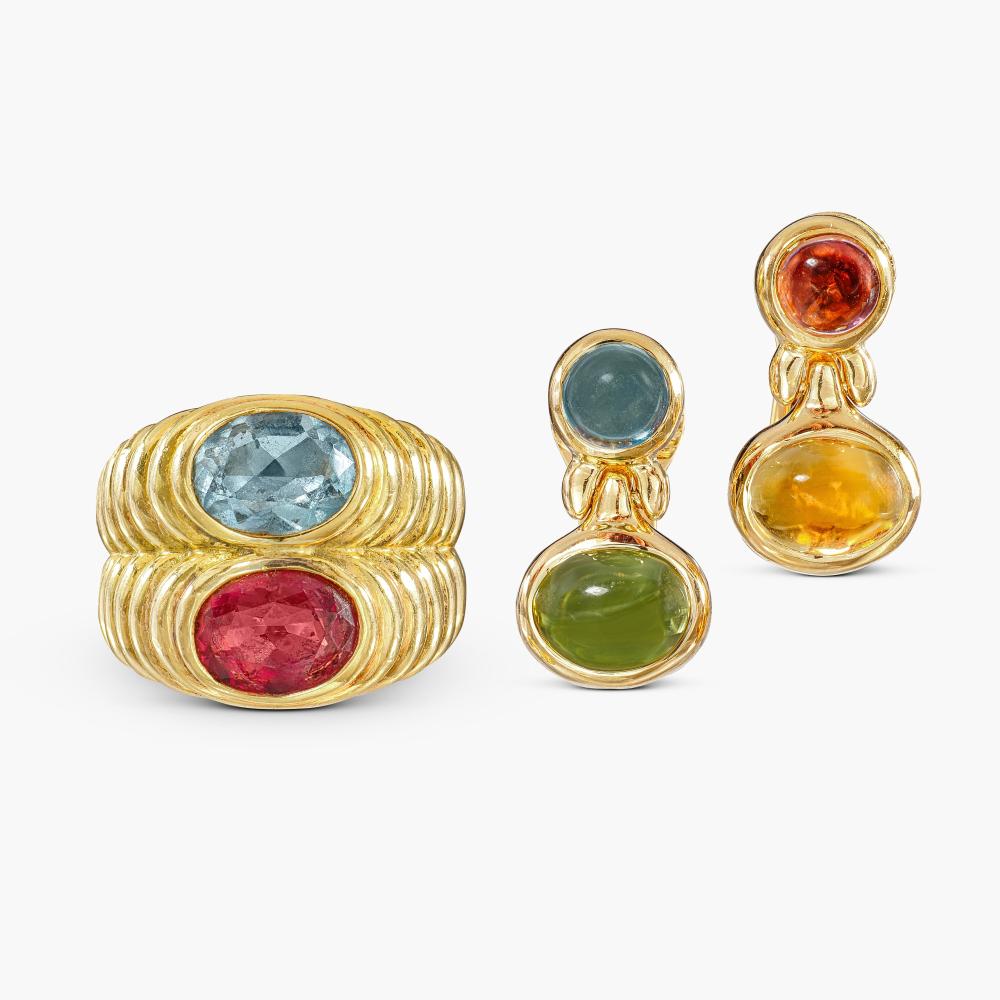 Bulgari

The ring set with oval pink tourmaline and blue topaz; and a pair of earrings en suite.