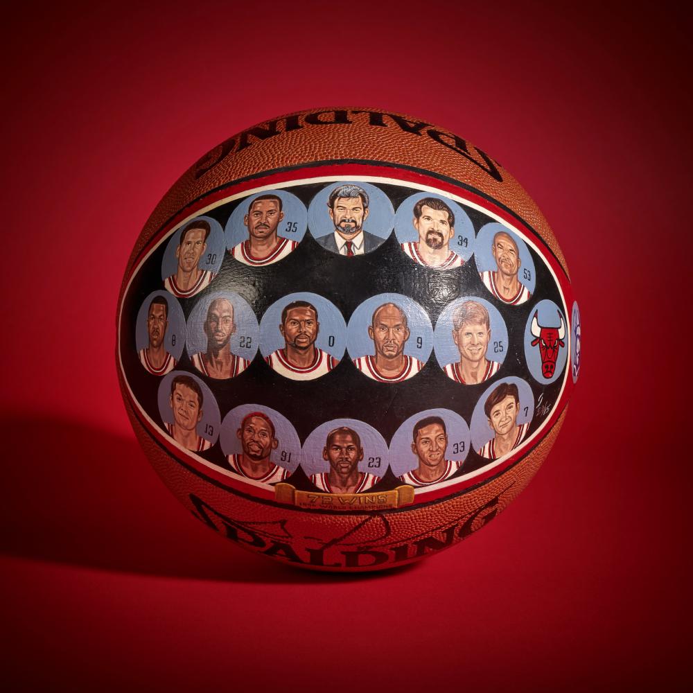 1995-1996 Chicago Bulls ‘NBA Champions’ Painted Basketball | Signed by Scottie Pippen

Acrylic on Spalding Basketball

Circa 1996

This hand painted basketball depicts the members of the 1995–1996 Chicago Bulls, the team widely regarded as one of the greatest in NBA history. Chicago dominated the regular season, finishing with a 72–10 record — the best in NBA history at the time.

Led by Scottie Pippen and Michael Jordan, the Bulls re-established themselves as the league’s premier team. Pippen provided steady scoring and elite defense that became standard in his time with the Bulls, finishing top 5 in both MVP and NBA Defensive Player of the Year voting.

Supported by a championship-caliber teammates including Dennis Rodman, Toni Kukoč, Ron Harper, Luc Longley, and Steve Kerr, the Bulls navigated the postseason with authority. They overcame the Miami Heat, New York Knicks, and Orlando Magic in the Eastern Conference, dropping only 1 game on the way to the Finals. In the 1996 NBA Finals, the Bulls defeated the Seattle SuperSonics in 6 games.

The painting depicts this historic team and their coach: Scottie Pippen, Michael Jordan, Dennis Rodman, Toni Kukoc, Luc Longley, Dickey Simpkins, John Salley, Randy Brown, Ron Harper, Steve Kerr, Jud Buechler, Jason Caffey, Phil Jackson, Bill Wennington, and James Edwards.

This basketball comes directly from the Collection of Scottie Pippen.

The basketball is accompanied by a letter from James Spence Authentication in regards to the signature.