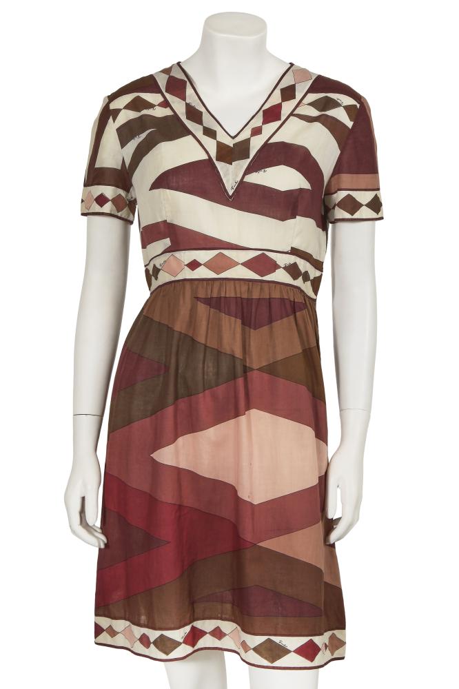 An Emilio Pucci printed cotton mini dress, mid-1960s

An Emilio Pucci printed cotton mini dress, mid-1960s

labelled, additional Lord & Taylor label, size 12, printed with brown, red, and pink geometric repeats on a cream ground, the hem, cuffs and neckline printed with diamond-shaped pattern repeats, with short sleeves, v-neck, bust 91cm 36in

Share this lot: