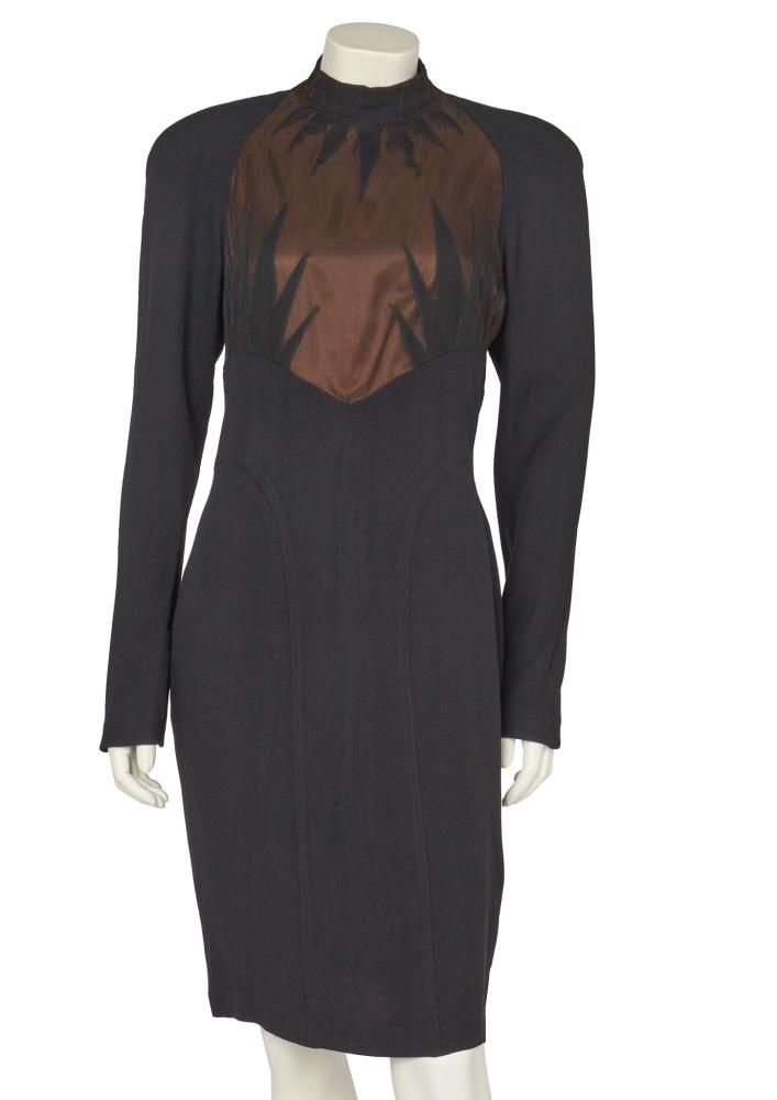 A Thierry Mugler black crêpe and chiffon cocktail dress, circa 1990

A Thierry Mugler black crêpe and chiffon cocktail dress, circa 1990

labelled, the bodice with beige lining overlaid with black chiffon, with spikes of fabric to neck and breast areas, padded shoulders, panelled skirt, bust approx 86cm 34in

Share this lot:
