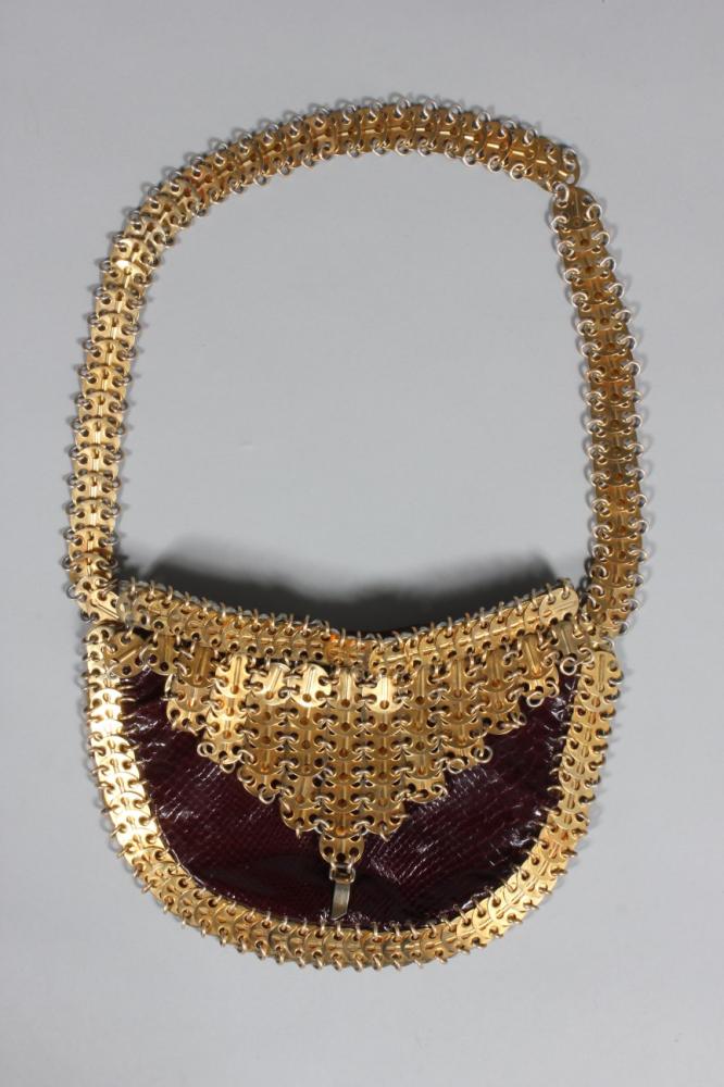 

A Paco Rabanne gilt chain-mail and wine snakeskin shoulder bag, late 1960s, lycodonomorphus rufulus, with metal maker’s label to the interior, 29cm, 11in wide
