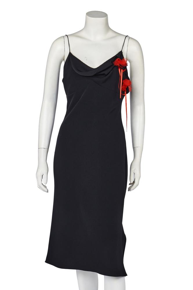 A John Galliano black crêpe dress with fabric corsage, commercial collection 2001

A John Galliano black crêpe dress with fabric corsage, commercial collection 2001

labelled, size M, of bias-cut, with cowl neckline, red tulle and black silk corsage to left bust area, side slit, bust approx 86cm 34in

Share this lot: