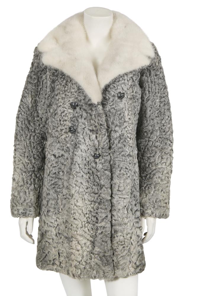 A Schiaparelli grey astrakhan coat, late 1950s-early 60s

A Schiaparelli grey astrakhan coat, late 1950s-early 60s

labelled, double-breasted with domed grey buttons, white fur collar, chest 107cm 42in

Share this lot: