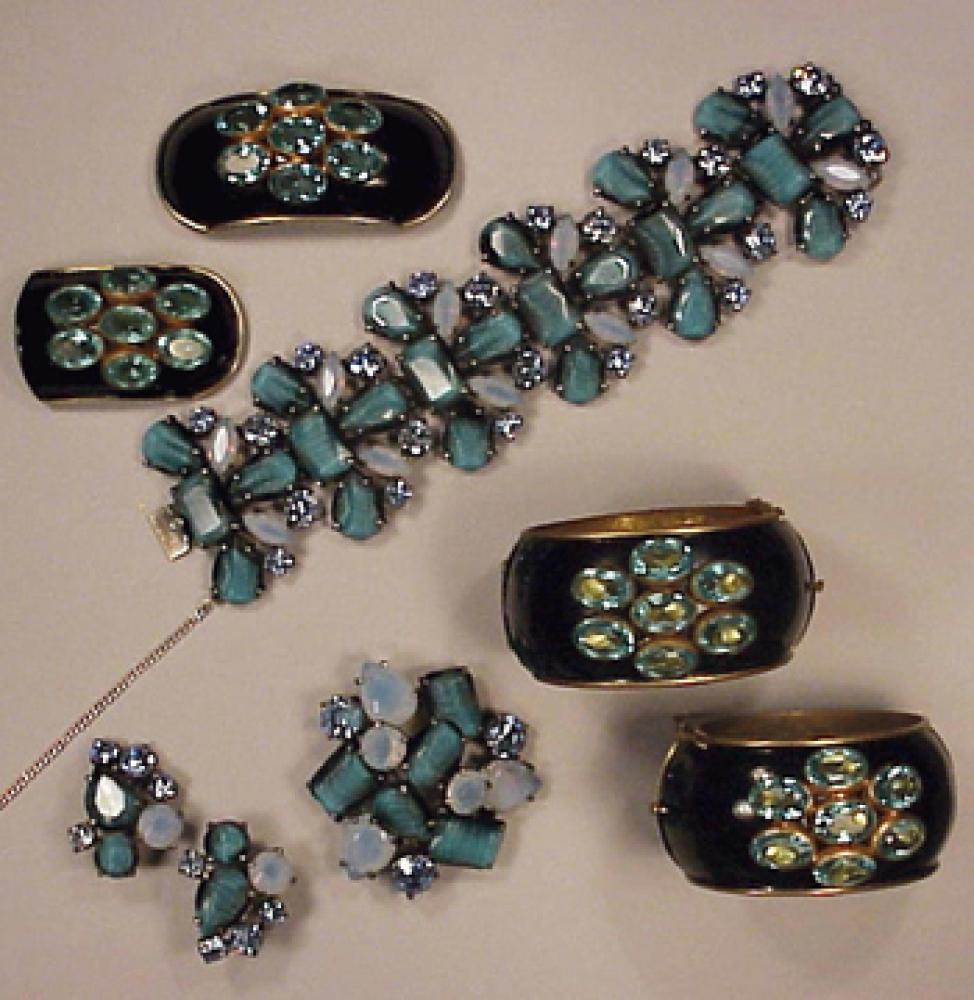 Two Sets Blue Stone Schiaparelli Jewelry 1950s

Lot 478
Two Sets Blue Stone Schiaparelli Jewelry 1950s
 1950s 
 Black enamel cuff bracelets and buckles set with blue stones and blue stone bracelet with earrings and brooch, marked.