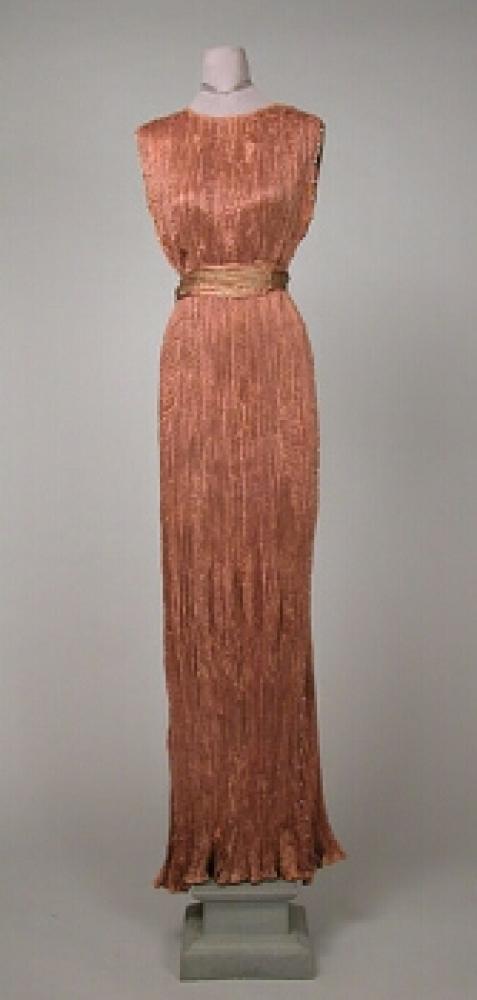 Fortuny Delphos Dress

Lot 512
Fortuny Delphos Dress
 1920s 
 Mocha brown pleated silk, Venetian beads down each side with stenciled belt, including Mariano Fortuny box. 
 Good condition, minor discoloration.

 Estate of Mrs. Henry Parish II