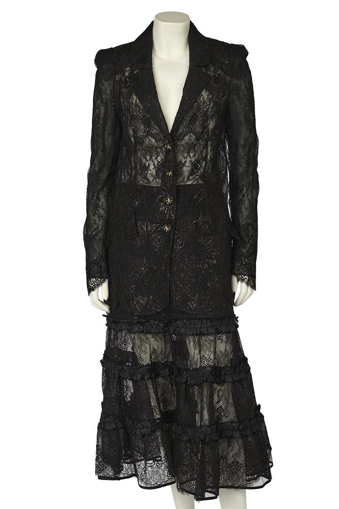 A Christian Lacroix black lace suit, Spring-Summer 1999

A Christian Lacroix black lace suit, Spring-Summer 1999

pink labels, the jacket with floral glass buttons centred with gilt stamen, faux pearls and rhinestones, with notched lapels, faux flap pockets, size 38, bust 91cm 36in; the matching skirt semi-lined in black satin, with tiered ruffles to hem, size 40, waist approx 66cm 26in (2)

Share this lot: