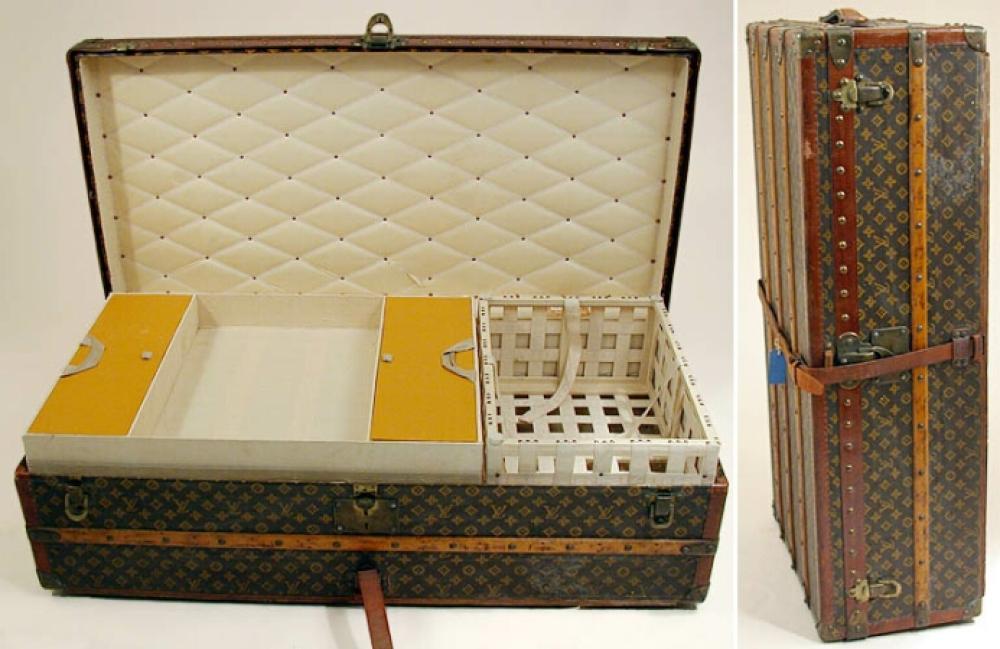 Louis Vuitton Trunk

Lot 999
Louis Vuitton Trunk
 French, 1930s 
 Monogram canvas, LV stamped leather trim, wood bands, brass fittings and locks and studs, bottom wheels, leather side handles and center strap, linen interior with quilted cotton lid, webbed tray on right and two overlaying trays on left, the top with lidded compartments and cotton handles, 12 1/2 x 43 1/2 x 21 1/2 inches, interior orange label: Louis Vuitton/Paris/70 Champs-Elysees/149 New Bond St./London.W./Nice/12 Ave de Verdun/Lille/34 Rue Faidherbe/No.759049.
Good condition, shows general wear, slight interior discoloration, one tear in quilting ribbon.