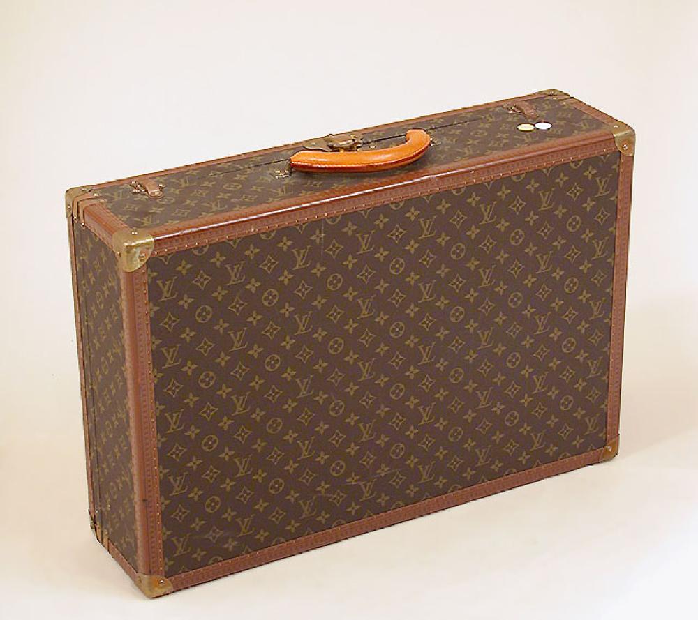 Louis Vuitton Suitcase

Lot 1006
Louis Vuitton Suitcase
 Monogram canvas, LV stamped leather trim, brass locks and corners, lock no. 179714, replaced rolled leather handle, canvas interior with two linen straps, with keys, 17 1/2 x 26 x 7 inches, interior label: Louis Vuitton/Av Marceau 78 Paris/Nice 2 Av du Suede, no.982663. 
Excellent condition.