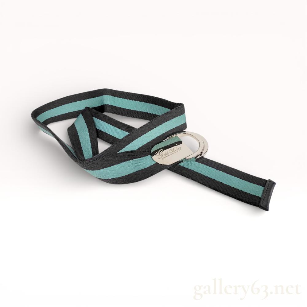 Description
Authentic Gucci Sherry line blue and black canvas variable length belt with Gucci branded palladium tone hardware. 38 inch total length. This belt will fit a wide variety of waists.