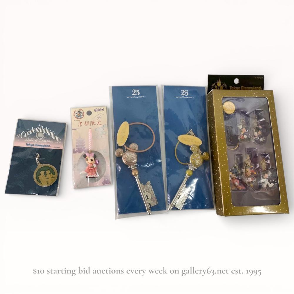 Description
Tokyo Disneyland and Tokyo Disney Resort commemorative souvenir collection, circa 2003-2008. This assortment features a boxed 20th Anniversary strap set with five Mickey Mouse figure charms, two 25th Anniversary beaded key charms, a Kyoto limited Minnie Mouse kimono charm, and a Cinderellabration die-cast metal charm. The items are constructed from SBS resin, ABS resin, alloy, and nylon, with several pieces featuring metallic and pearl-style bead accents. All pieces retain original retail packaging with Tokyo Disney Resort price labels and manufacturer marks.
