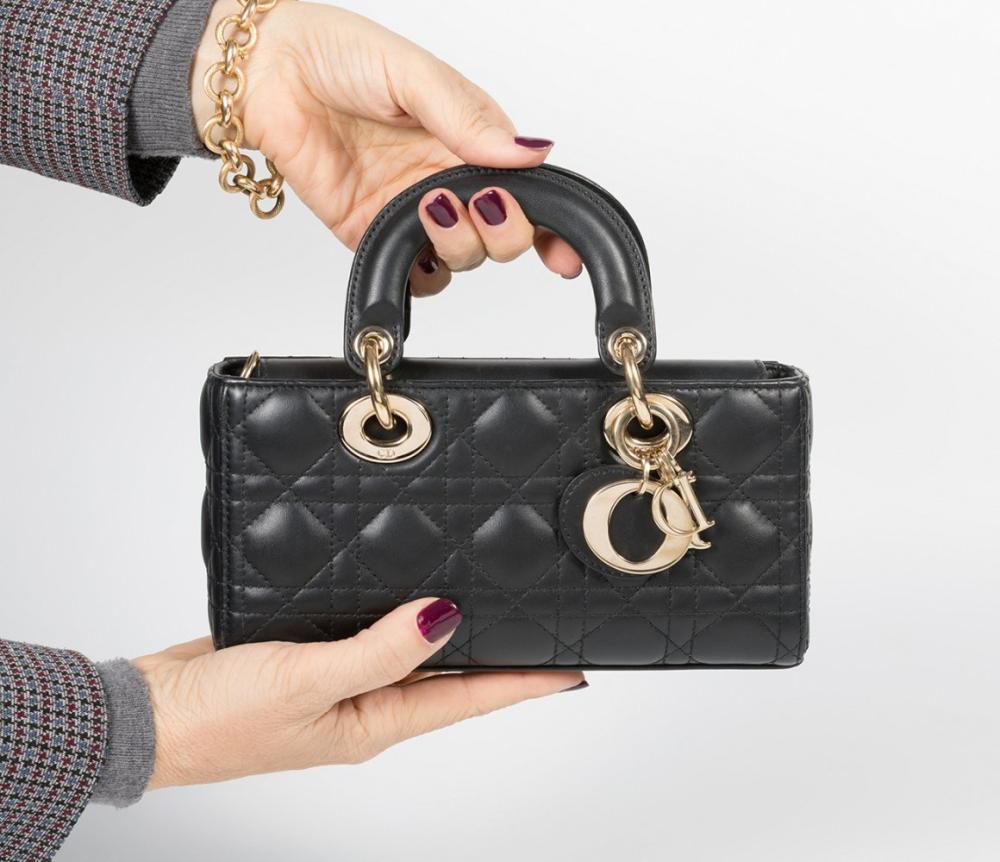 Description

CHRISTIAN DIOR.
Dior Lady Dior Micro or Nano bag.
Black leather with cannage stitching. Gold hardware. Double short top handle. Charms D.I.O.R. Double shoulder strap (short and long).
Brand new.
Measurements: 22 x 11 x 4 cm.

Lady Dior is one of the most emblematic bags in history. It was launched in 1994 and was originally called "Chouchou". In 1995 Bernadette Chirac received Princess Diana of Wales in Paris and gave her this beautiful bag, which would soon be renamed Lady Dior in honor of the princess. The love affair was immediate, and Diana Spencer would appear from then on wearing it on her travels around the world. In January 1996 the bag arrived in the boutiques being a great success, since then the Maison decided to rename it Lady Dior in honor of Princess Diana of Wales. We can find this bag in different materials such as lambskin, patent calfskin, deerskin, soft leather, grained leather, crocodile leather, Canvas or python leather, among others. Each piece requires the work of seven artisans and a minimum of eight hours to be made. Likewise, about 130 pieces are needed to be delicately cut and sewn by hand.