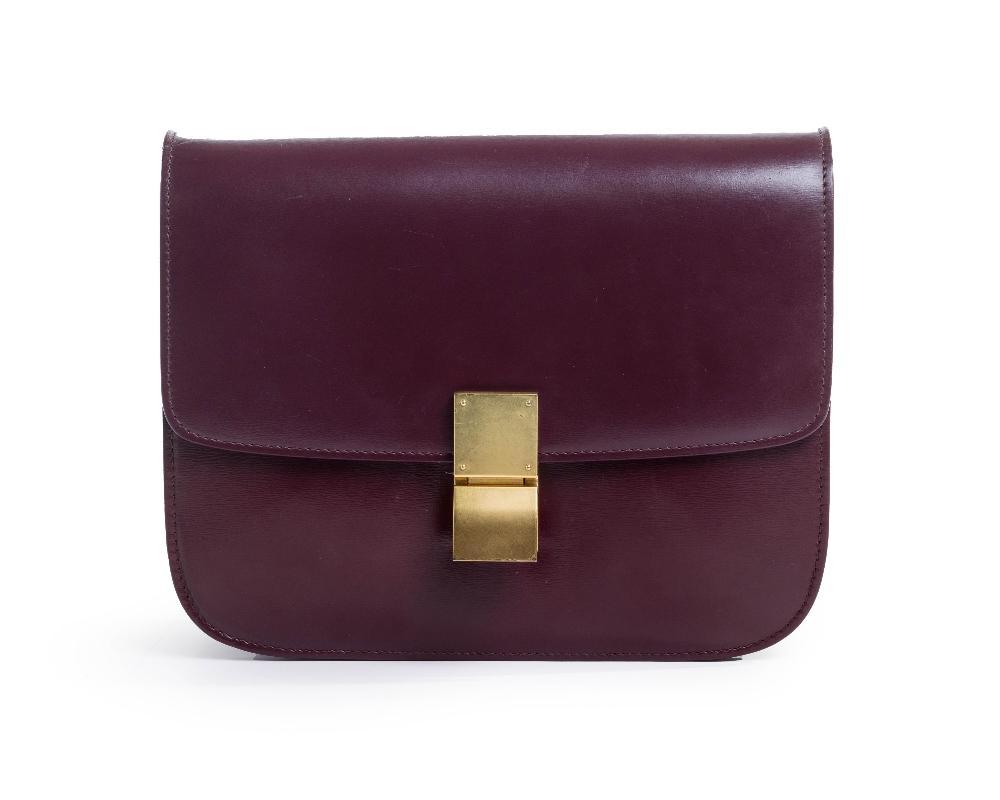 Description
Celine by Phoebe Philo. 

Box Bag, 2019, of smooth burgundy smooth calfskin leather and gold-toned hardware, detailed with a detachable strap, comes with the bag, straps and dustbag of the straps only

Width x Height x Depth: 24 x 19 x 6 cm