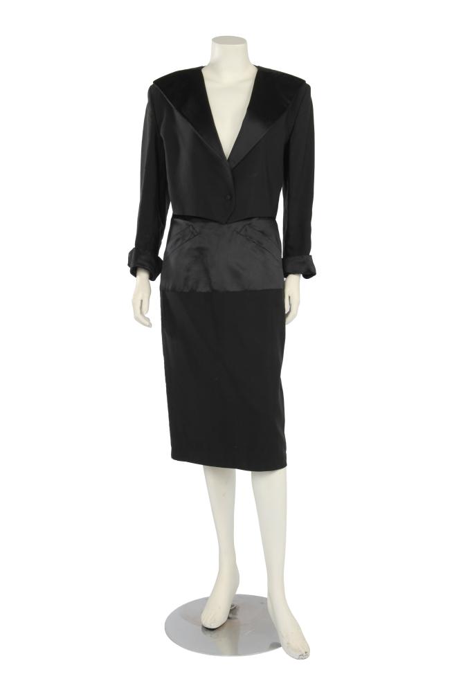 A Claude Montana black ottoman and satin suit, late 1980s

A Claude Montana black ottoman and satin suit, late 1980s

labelled, size IT 42, the cropped jacket with padded shoulders, wide black satin lapels, triangular silk organza insert to centre back, single button closure, bust 86cm 34in; the matching pencil skirt with satin upper, ottoman lower, waist 71cm 28in (2)

Share this lot: