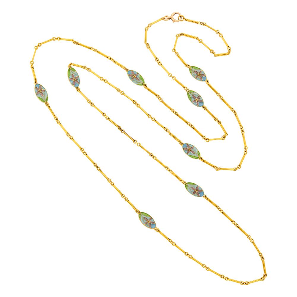 Property from a Prominent Maryland Collection15 ct., eight blue, green and purple plique-á-jour enamel oval links, circa 1900, ap. 23.2 dwts. Length 50 1/4 inches.

One link with few small hairline cracks to enamel, slightly visible to eye.Oval links 3/4 x 3/8 inch.                            
Any condition statement is given as a courtesy to a client, is an opinion and should not be treated as a statement of fact and our Organization shall have no responsibility for any error or omission. Please contact the specialist department to request further information or additional images that may be available.