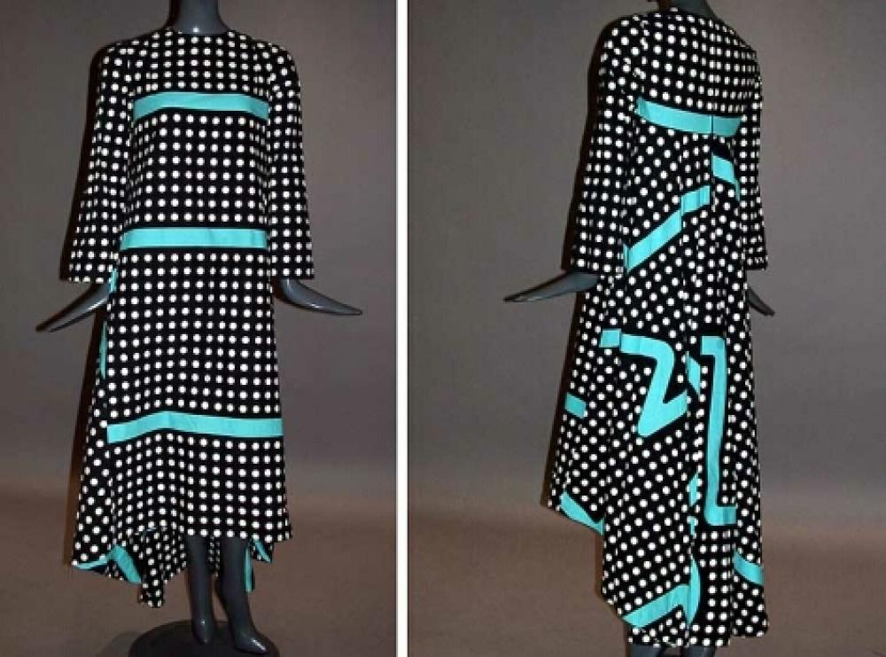 Marimekko Polka Dot Dress

Lot 553
Marimekko Polka Dot Dress
 1970s 
 Of black and white polka dot cotton, with turquoise accent stripes, empire waisted, floor length with extra length and fullness at back, size XS, labeled: Marimekko/Suomi/Finland.
Excellent condition.