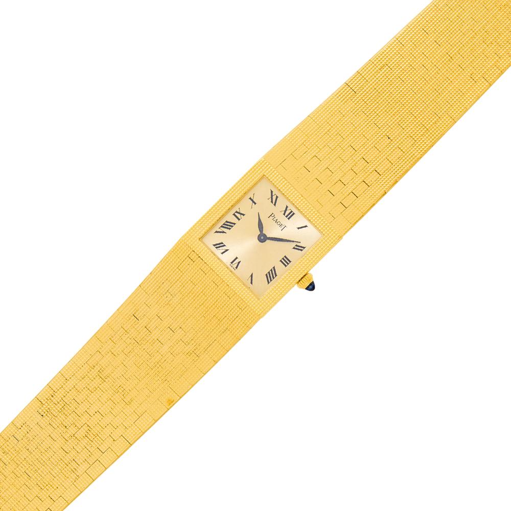 Property from a Prominent Maryland Collection18 kt., mechanical, square brushed gold-tone dial, black Roman numerals, black hands, round cabochon sapphire crown, case diameter ap. 21 x 20 mm., waffle-textured bezel and brickwork link bracelet with fold-over clasp, dial, movement, case and clasp signed Piaget, case no. 374622, ap. 54.7 dwts. gross. Length 6 1/2 inches.

The movement is currently running, but not guaranteed to be in working order.Case diameter 13/16 x 13/16 inch.Bracelet width 13/16 to 11/16 inch.                            
Any condition statement is given as a courtesy to a client, is an opinion and should not be treated as a statement of fact and our Organization shall have no responsibility for any error or omission. Please contact the specialist department to request further information or additional images that may be available.