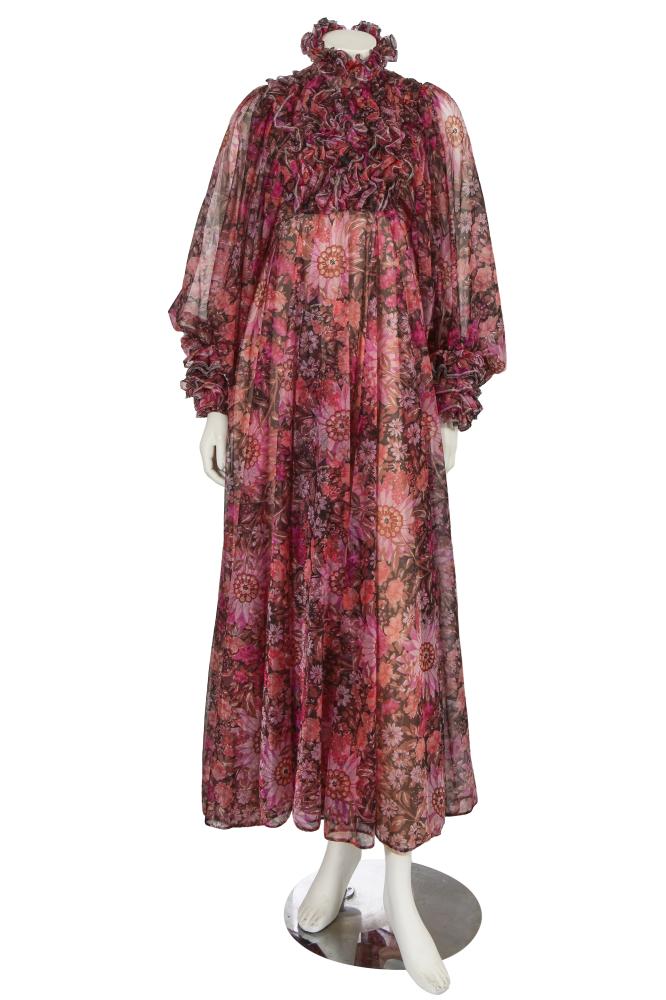 A Jean Varon printed floral maxi dress, circa 1970

A Jean Varon printed floral maxi dress, circa 1970

labelled, of shimmering sheer polyester printed with pink, purple and black flowers, the high collar and front bib with layers of lettuce-edged ruffles, the oversized bishop’s sleeves terminating in dramatic frilled cuffs, the flowing skirt with pale pink acetate lining, waist 66cm 26in

Share this lot: