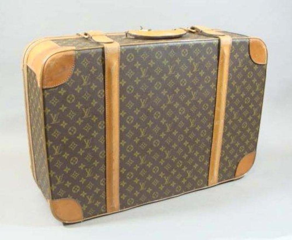 LOUIS VUITTON

Valise toile mongrammée avec cadenas et deux clefs 47 x 69 x 22 cm Usures d’usage