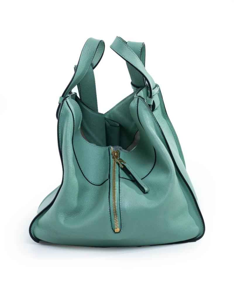 Description
Loewe.

Compact Hammock Bag, 2017, of soft-grained menthe calfskin and gold-toned hardware, further detailed with a adjustable strap, with a multi-purpose zip to the side, comes with the bag only 

Width x Height x Depth: 14 x 20 x 19 cm